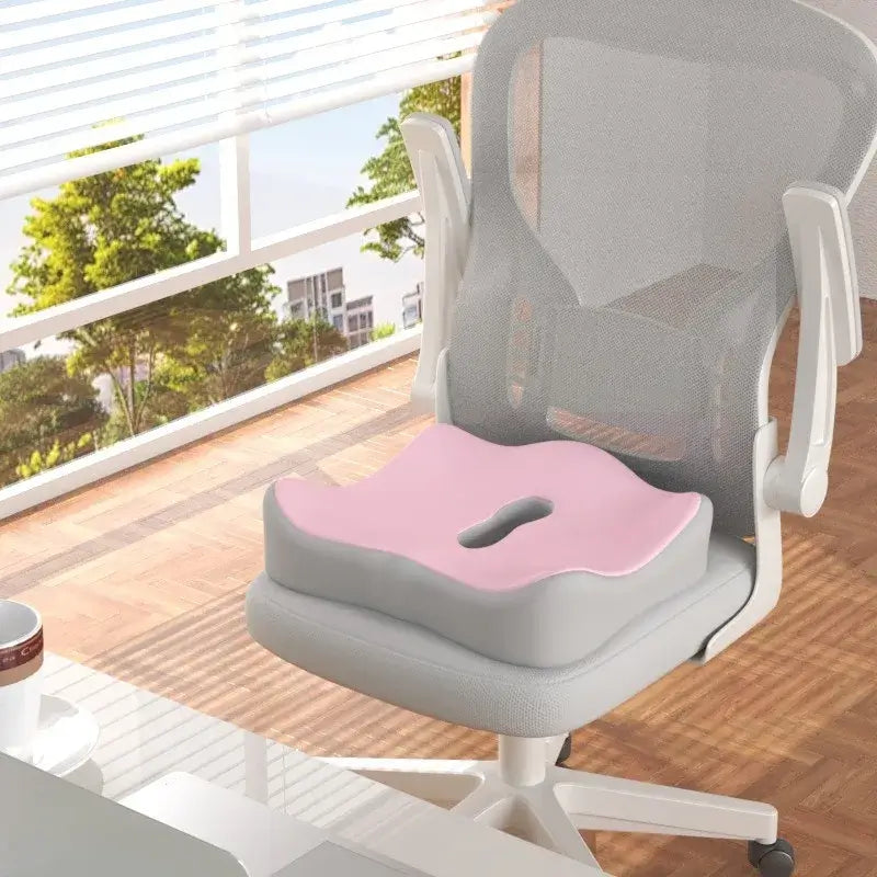 Ergonomic memory foam seat cushion with hollow design on an office chair, ideal for relieving hip pressure.