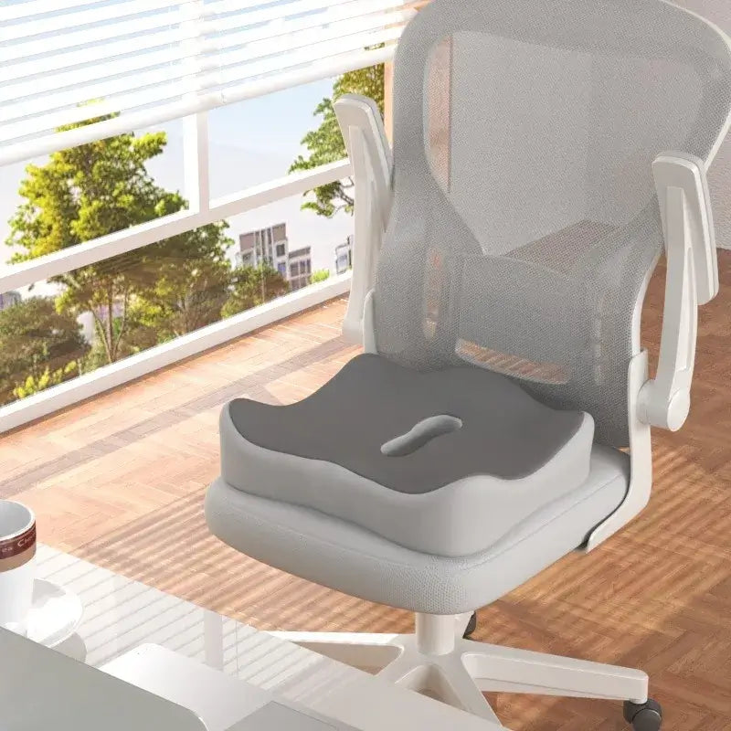 Ergonomic memory foam seat cushion on an office chair, designed to relieve hip pressure and enhance comfort.