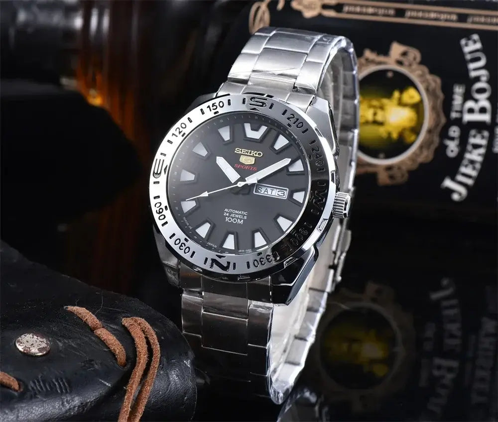Seiko SRP747J automatic quartz watch with luminous dial, steel band, and 100M water resistance, perfect for diving and sports.