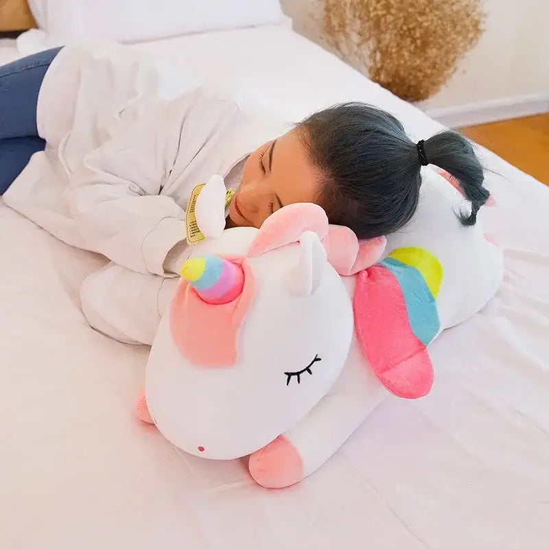 Cute child cuddles a colorful unicorn plush toy for comfort and play, ideal for kids' rooms and gifts.