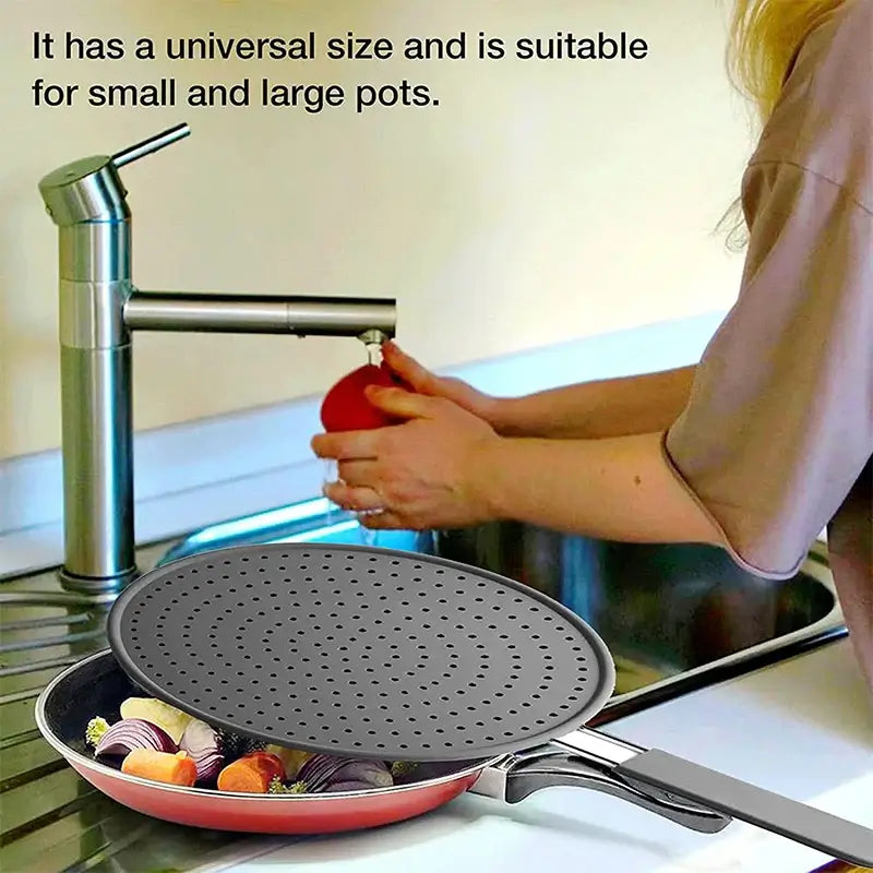Silicone splatter screen on frying pan with vegetables, showing universal fit for small and large pots, placed near a kitchen sink.