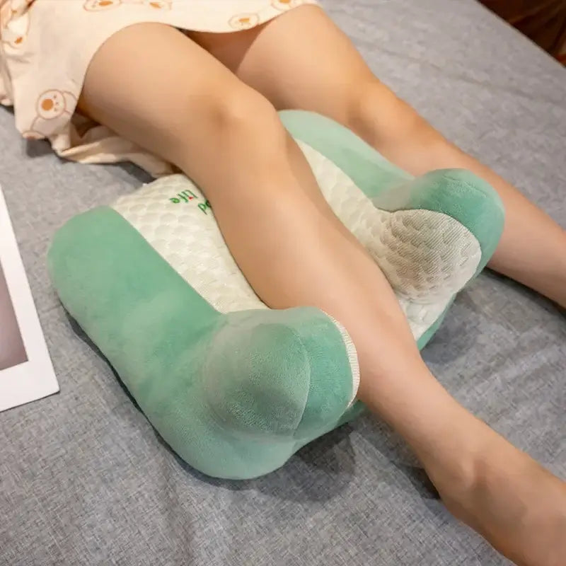 Multi-use soft cartoon back sleeper nap pillow on a bed, ideal for office, washable, with anti-slip bottom.