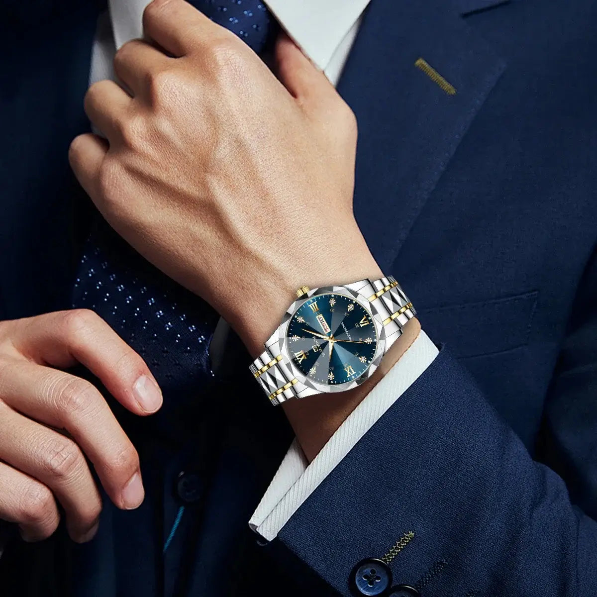 Men's luxury blue and gold quartz watch on a wrist in a formal suit, showcasing elegant night glow design.