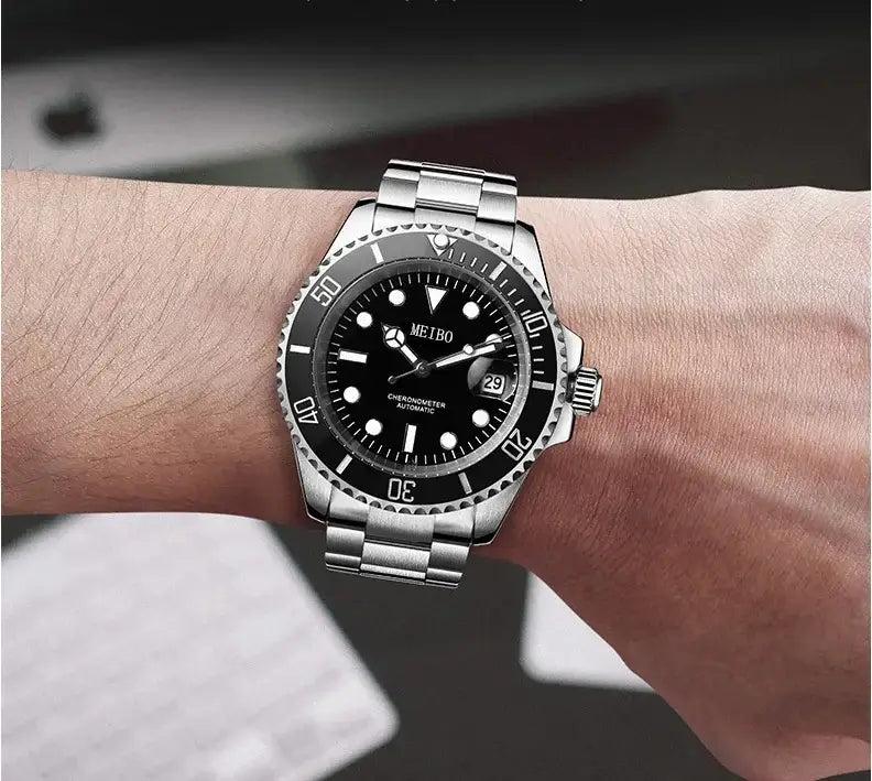 Luxury men's stainless steel quartz sports watch on wrist with black dial and silver bracelet.