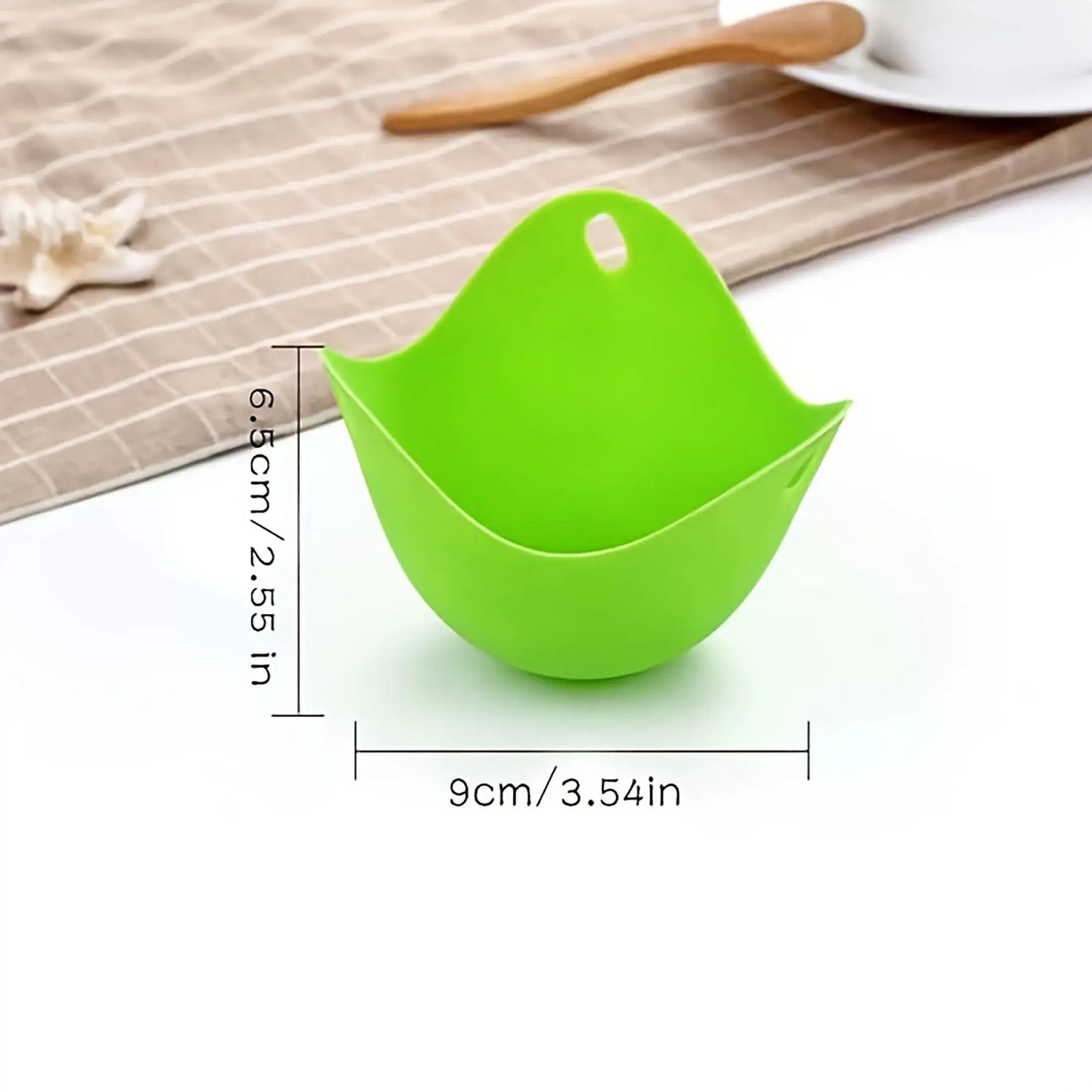 Green silicone egg poacher cup with dimensions, perfect for microwave, air fryer, and stovetop egg cooking.