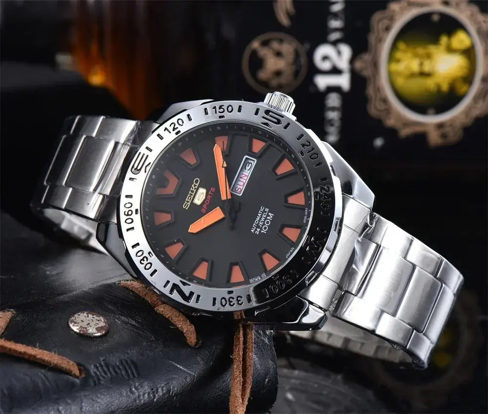 Seiko SRP747J men's automatic quartz diving watch with black luminous dial and steel band, 100M water resistance, retro style.