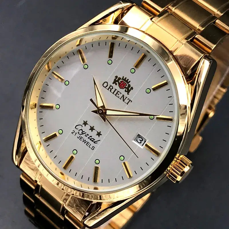 Orient luxury men's watch with gold stainless steel band, automatic mechanical movement, and date display.