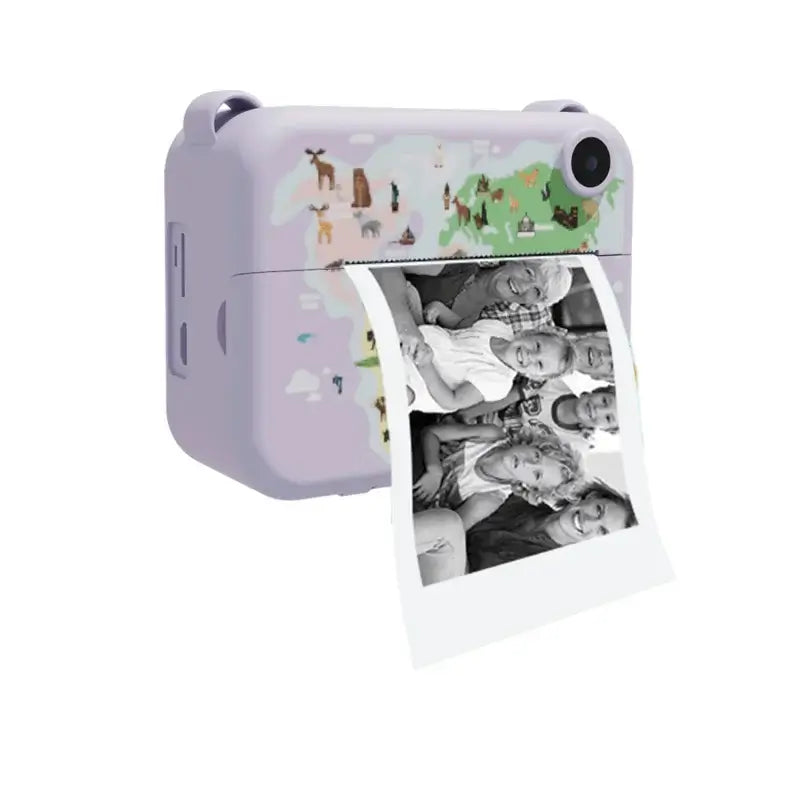 Digital children’s camera printing black-and-white photo, designed for kids to capture moments and memories.