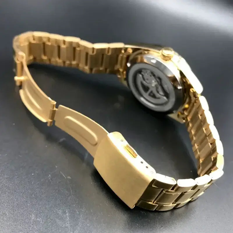 Gold stainless steel automatic watch with tourbillon movement, showcasing a luxury design for men.