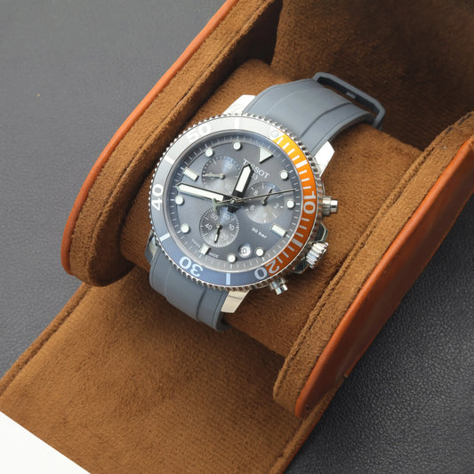 T-Star model T120.417 watch with liquid silicone strap and satin effect, displayed on a plush watch holder.