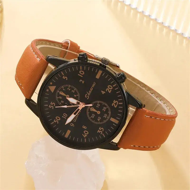 Luxury men's quartz watch with brown leather band and black dial, perfect for business or casual style.