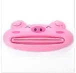 Cartoon pig design toothpaste squeezer for kitchen and bathroom, useful home tool made of plastic.