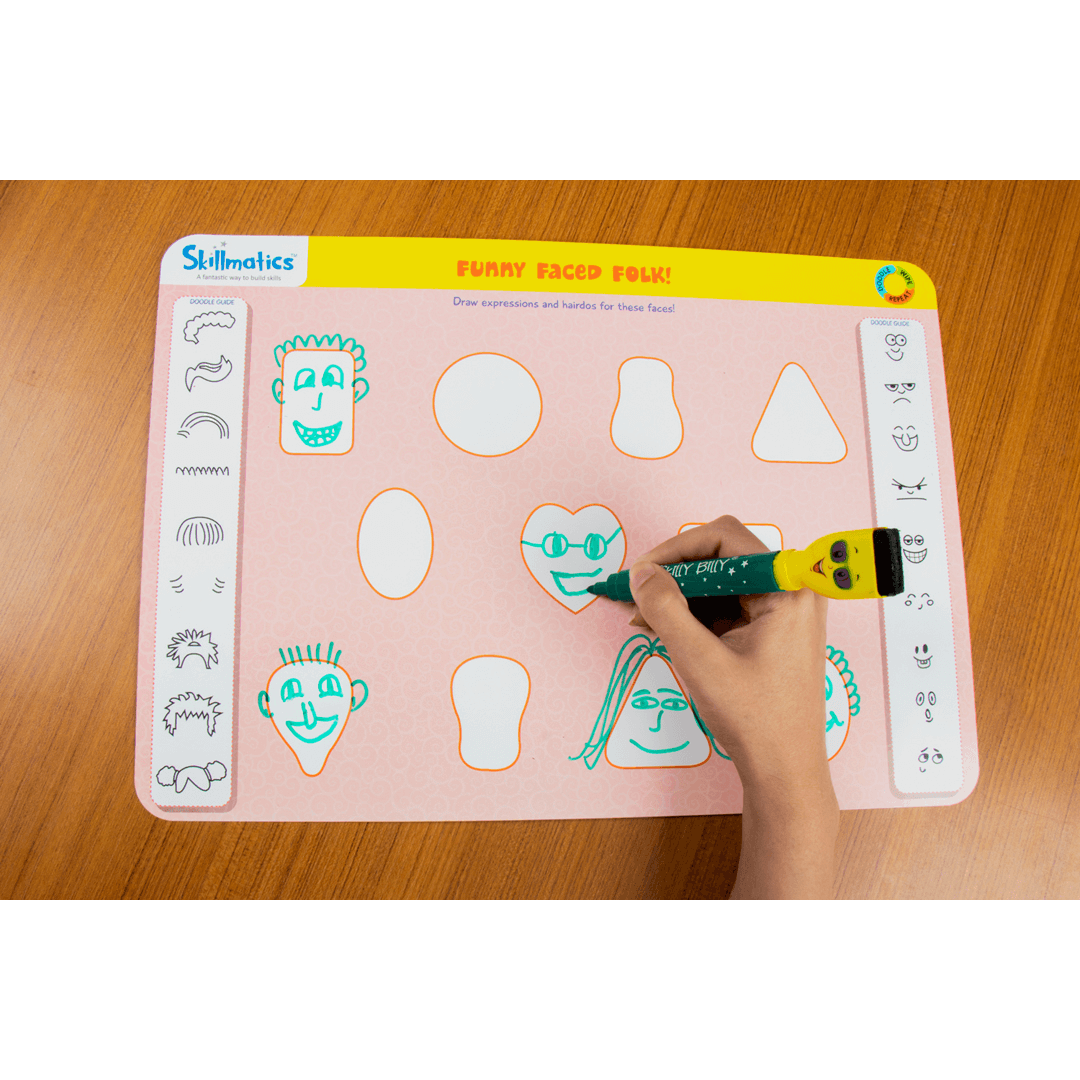 Child using Skillmatics Doodle and Draw activity mat with dry erase marker, developing creative thinking skills.