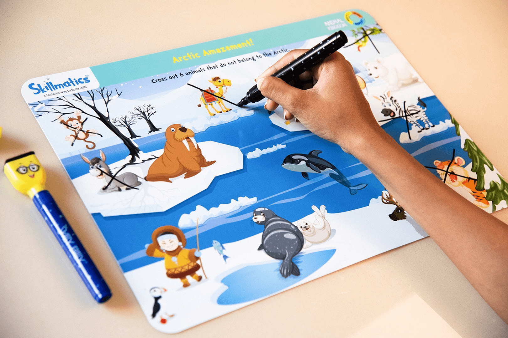 Child engaging with Skillmatics Arctic Animals activity mat using Skilly Billy pens.