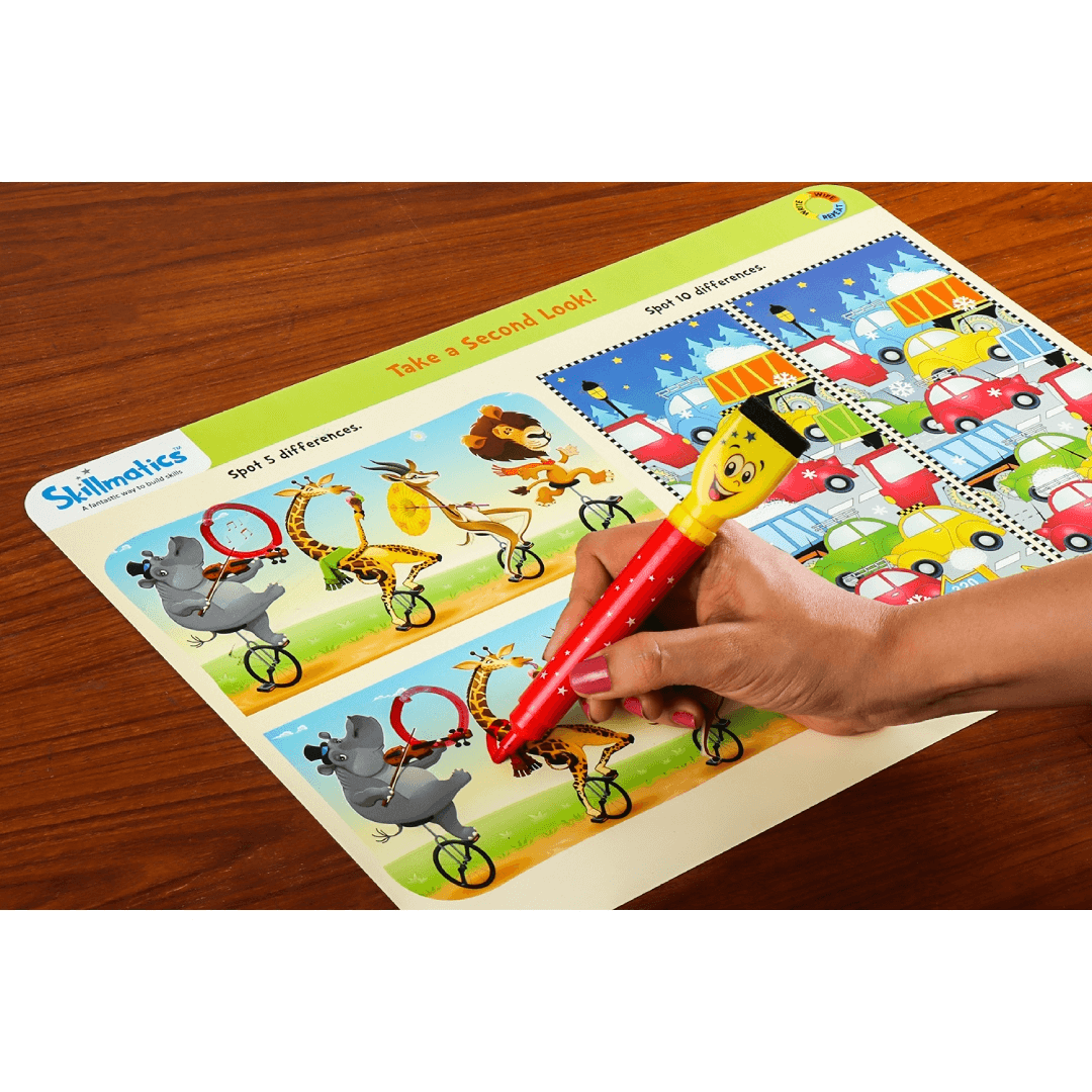 Child using a Skilly Billy pen on a Preschool Champion activity mat for developing logical reasoning and observation skills.