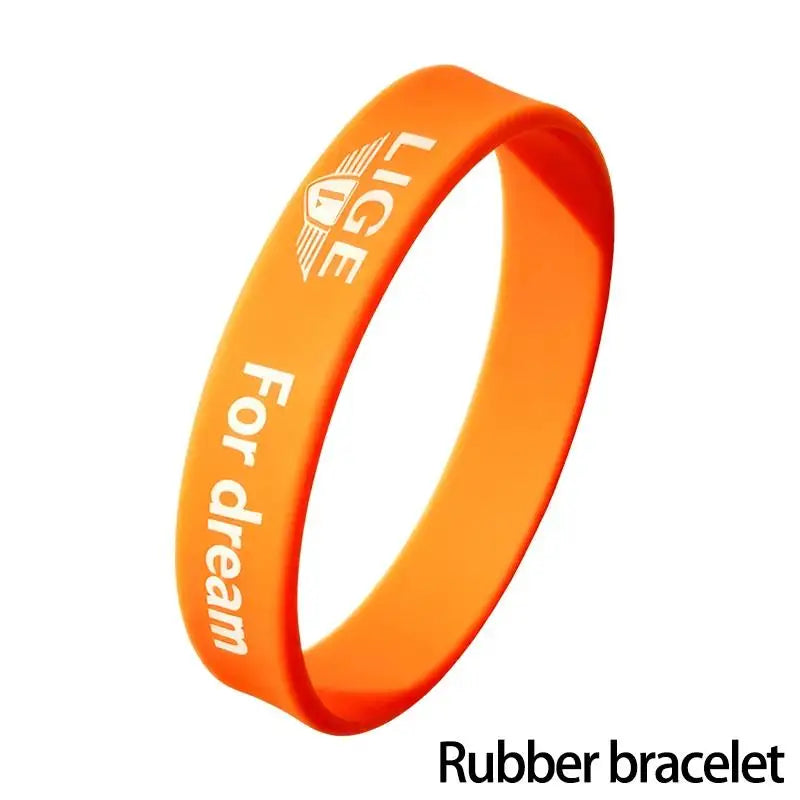 Orange rubber bracelet with text 'LIGE For dream'.