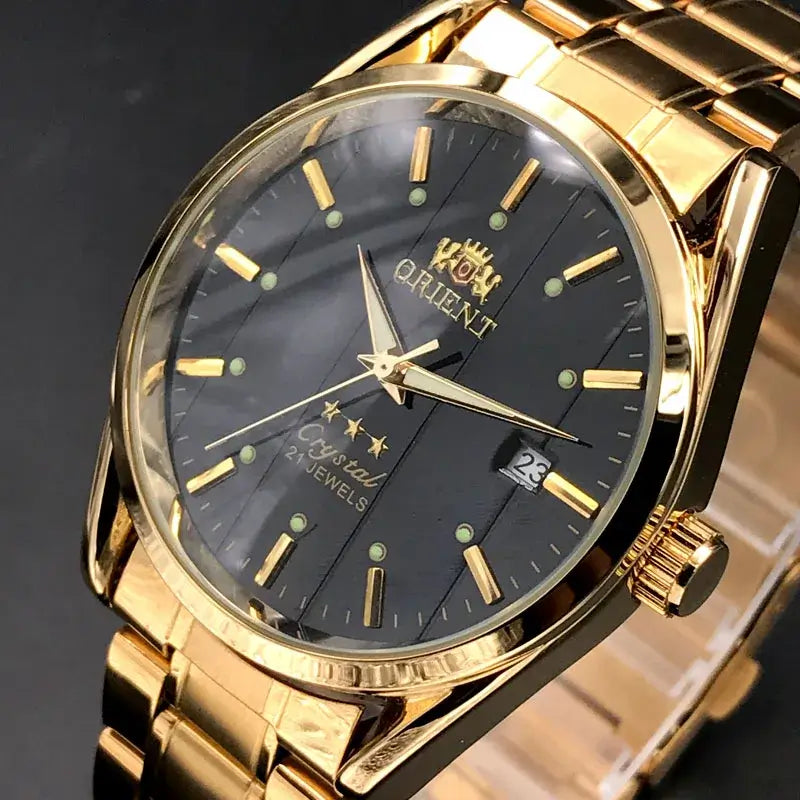 Orient luxury men's watch with gold stainless steel bracelet and black dial featuring automatic mechanical tourbillon.
