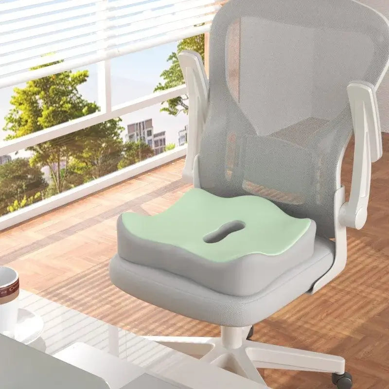 Ergonomic memory foam seat cushion on an office chair, designed to relieve hip pressure and provide comfort.