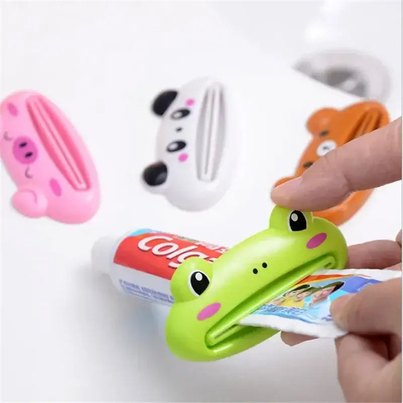 Cartoon toothpaste squeezer in frog shape, helping to extract paste from tube, colorful bathroom gadget and kitchen tool.