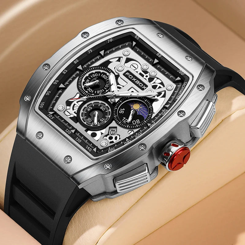 FOXBOX luxury men's chronograph watch with a bold tonneau shape and durable silicone strap on a cushion.