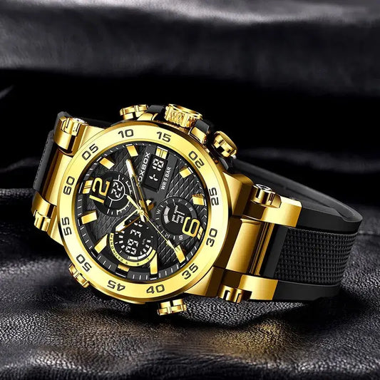 FOXBOX men's luxury chronograph watch with gold accents, black dial, and rubber strap on a dark background.